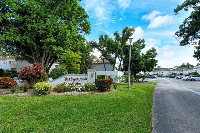 a view of a house with a yard and garden