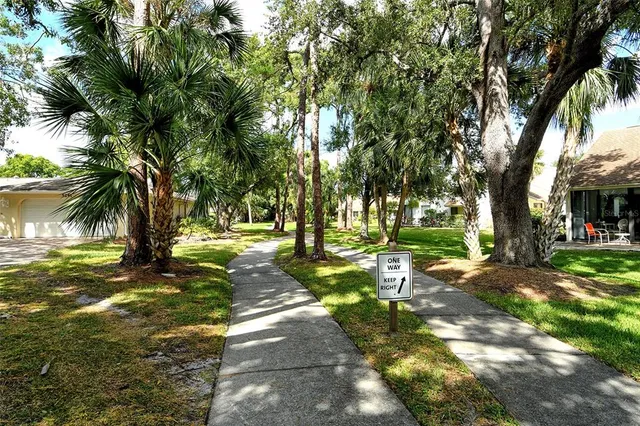 a view of a tree in front of a house
