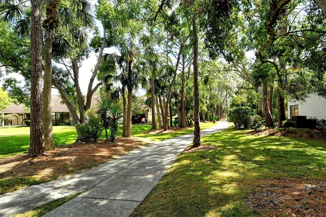 a view of an house with backyard space and garden
