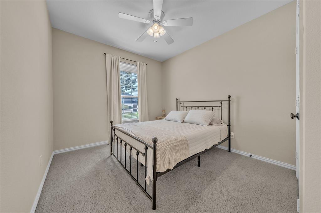 437 Rusty Run Drive Midlothian, TX 76065 - Photo 14 of 40 a bedroom with a bed and window