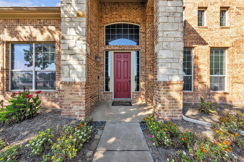 437 Rusty Run Drive Midlothian, TX 76065 - Photo 2 of 40 a front view of a house with a garden