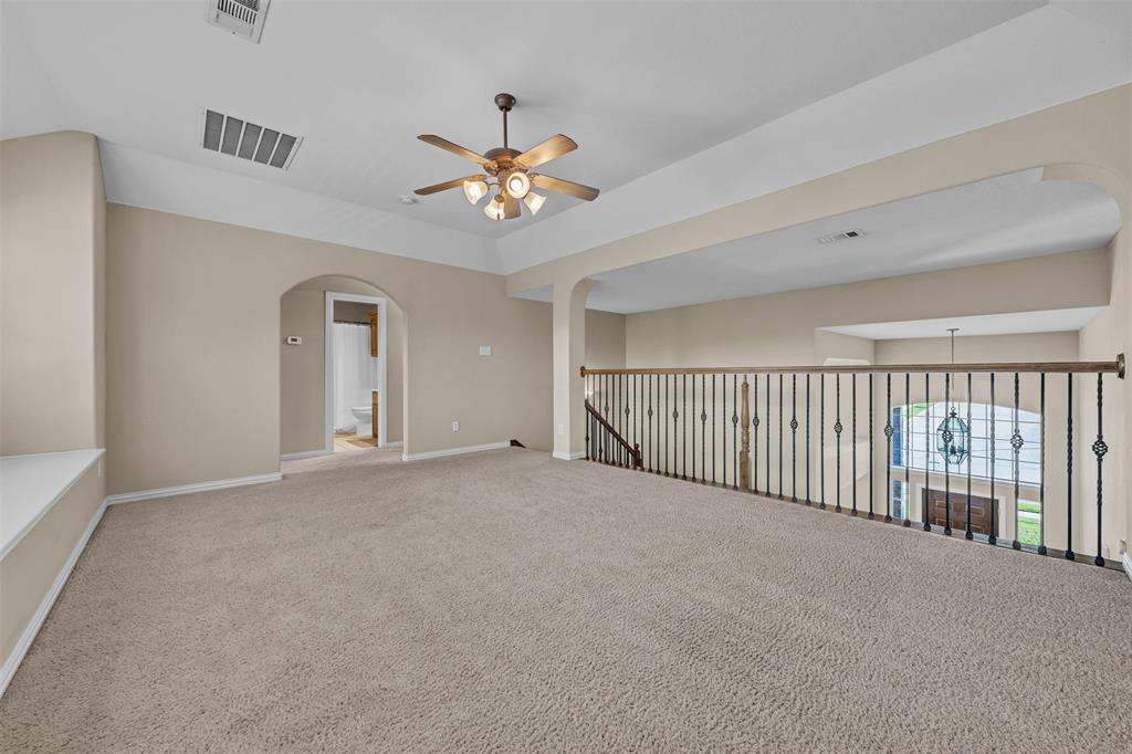 437 Rusty Run Drive Midlothian, TX 76065 - Photo 28 of 40 a view of a livingroom with a ceiling fan and hardwood floor