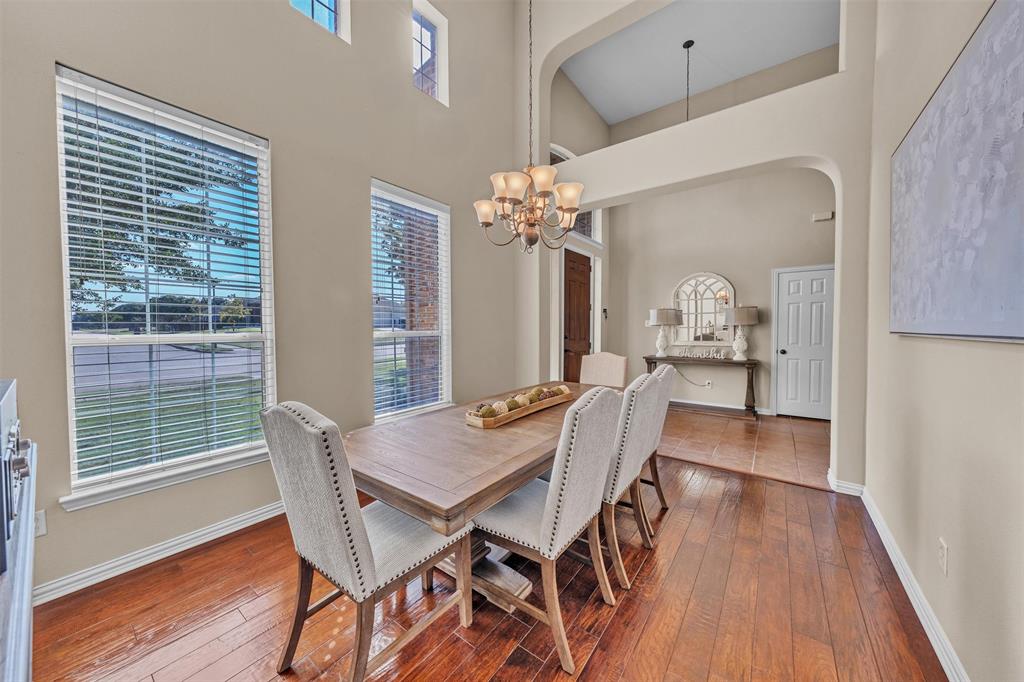 437 Rusty Run Drive Midlothian, TX 76065 - Photo 6 of 40 a view of a dining room with furniture wooden floor and chandelier