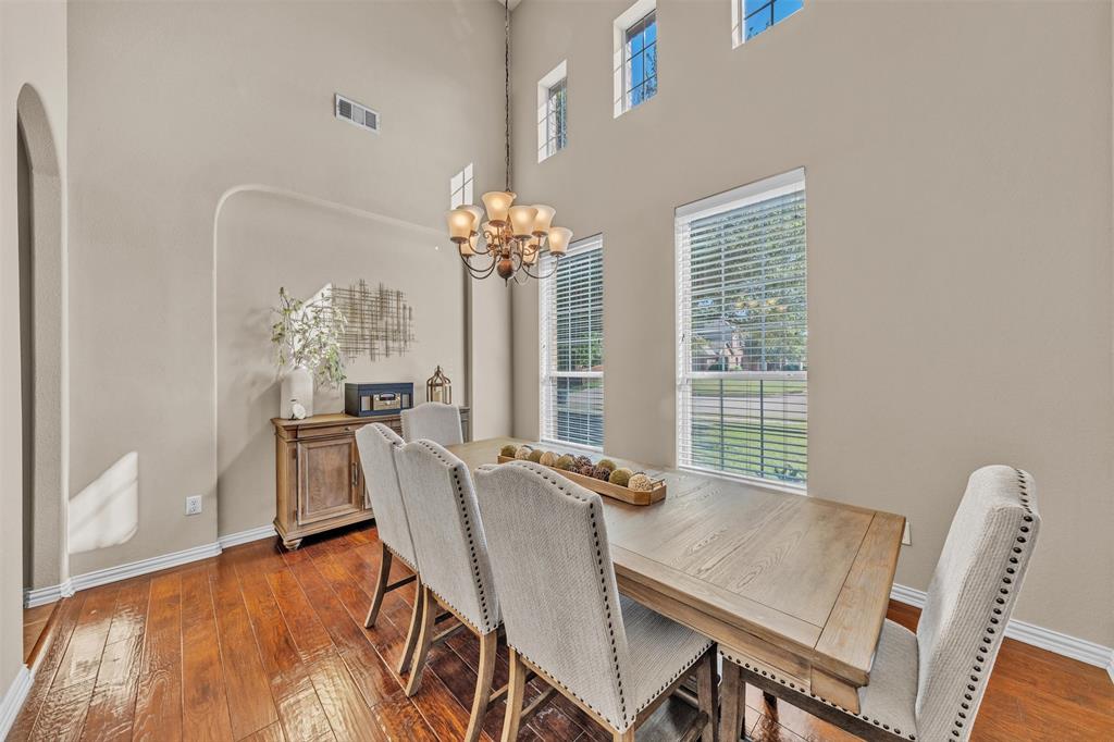 437 Rusty Run Drive Midlothian, TX 76065 - Photo 7 of 40 a view of a dining room with furniture window and wooden floor