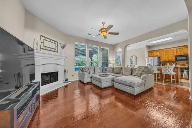 a living room with fireplace furniture and a fireplace