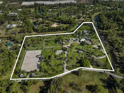an aerial view of a house with yard and outdoor space