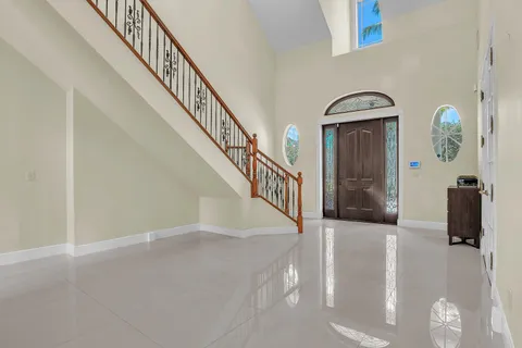 a view of livingroom with furniture flat screen tv and windows