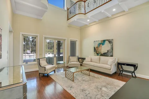 a bathroom with a granite countertop sink a toilet and shower