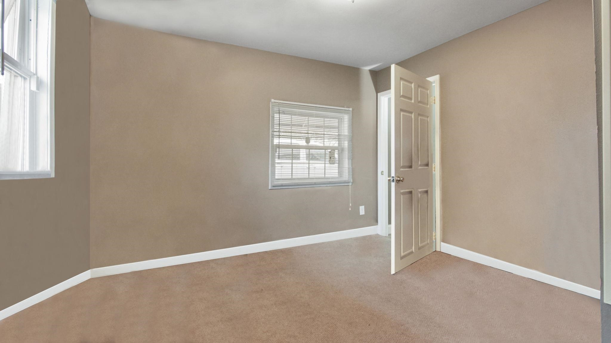 103 St Matthews Road Erwin, NC 28339 - Photo 11 of 14 an empty room with windows