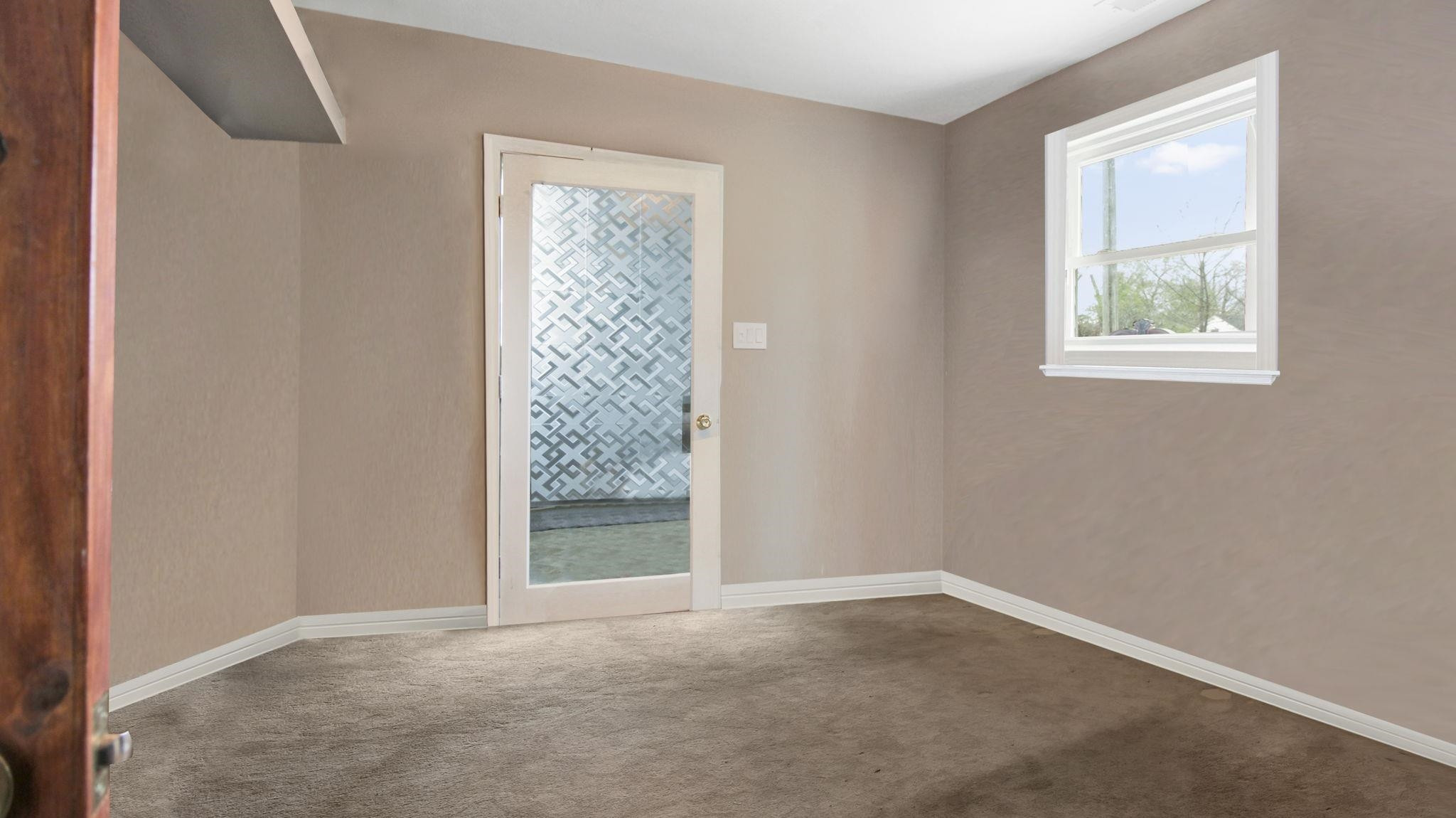 103 St Matthews Road Erwin, NC 28339 - Photo 6 of 14 an empty room with windows