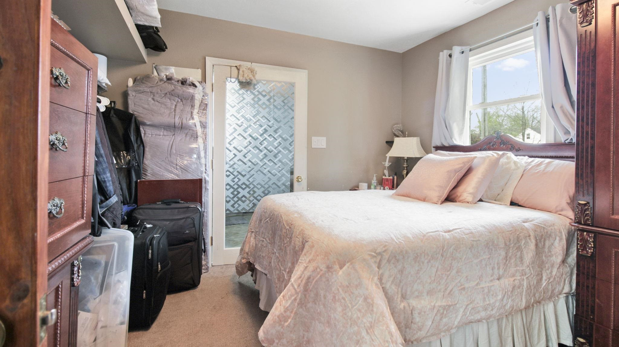 103 St Matthews Road Erwin, NC 28339 - Photo 7 of 14 a bedroom with a bed and a window