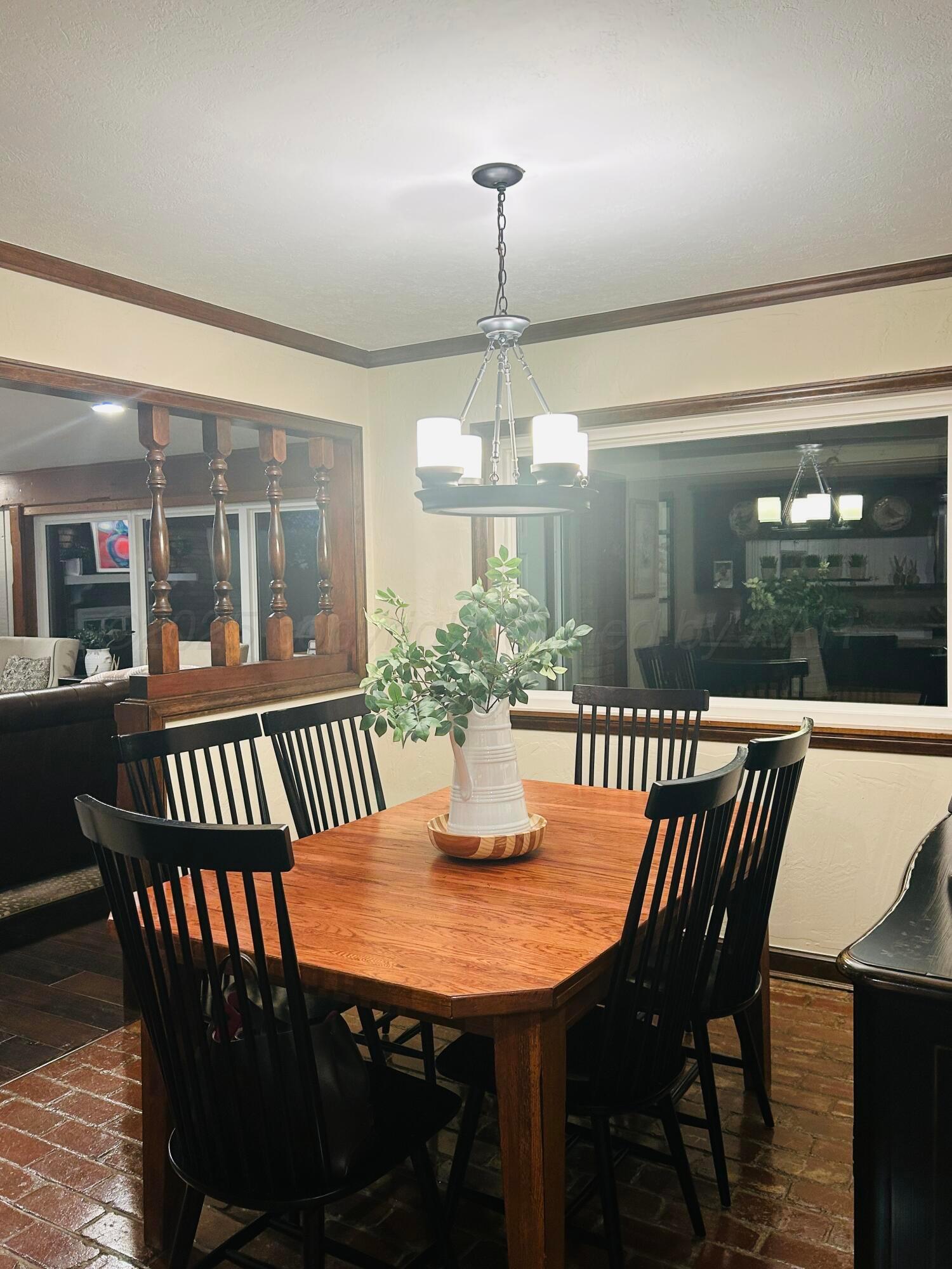 201 East 4th Street Higgins, TX 79046 - Photo 15 of 27 a view of a dining room with furniture window and wooden floor