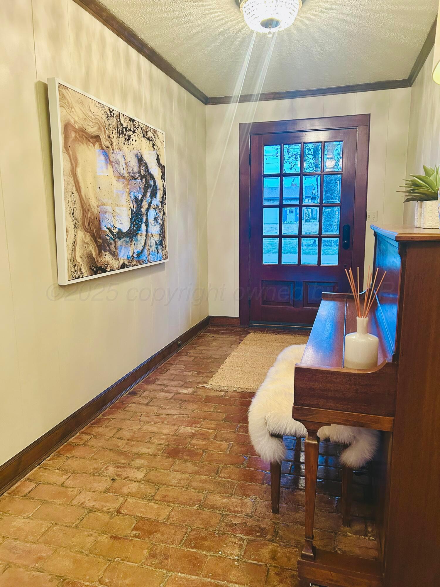 201 East 4th Street Higgins, TX 79046 - Photo 2 of 27 a living room with furniture and a large window