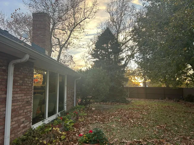 a view of backyard and garden
