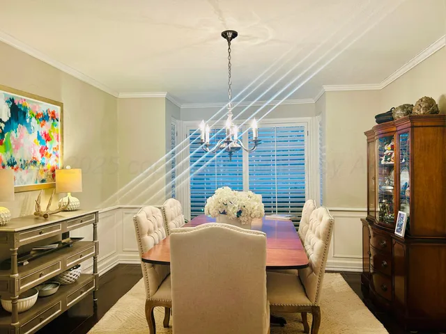 a dining room with furniture and wooden floor