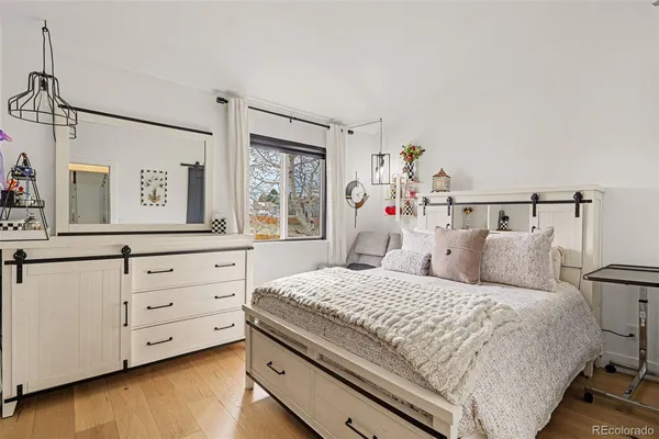 a bedroom with a bed and a dresser