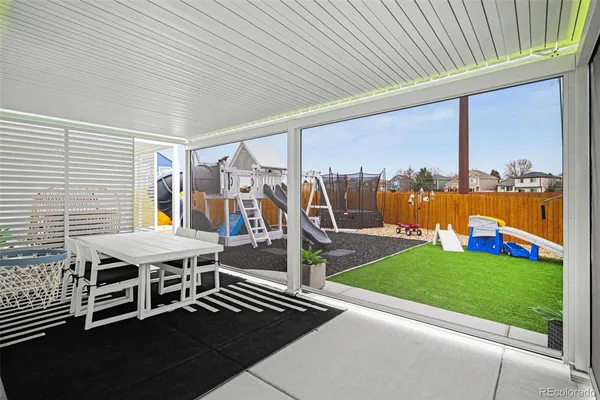 a view of a patio with a table chairs and a patio