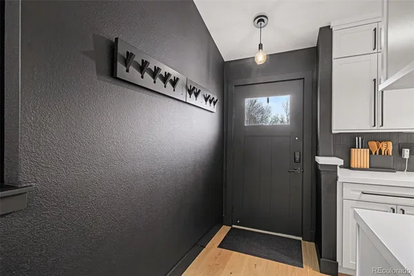 a kitchen with a refrigerator and cabinets
