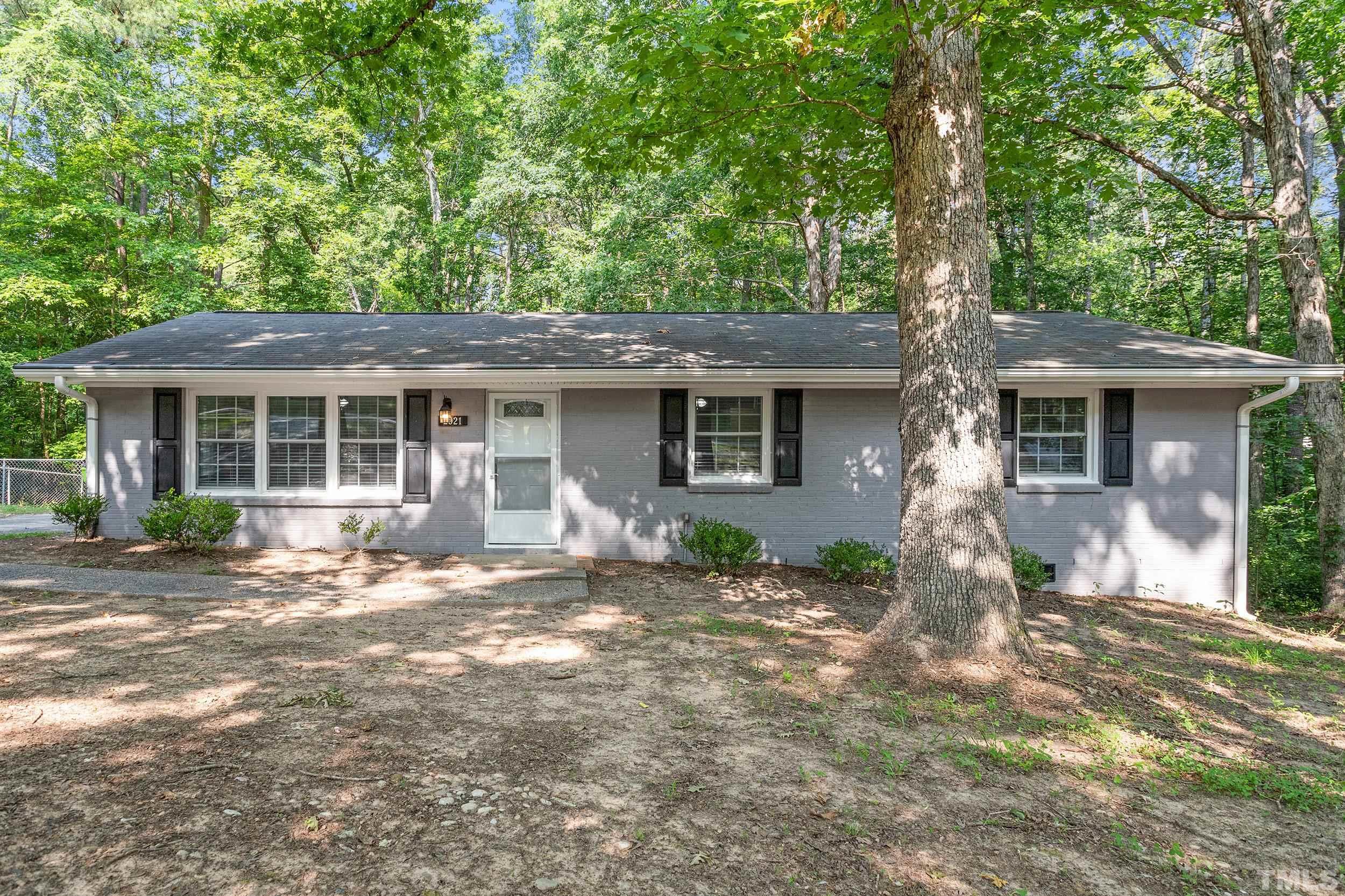 2921 Darrow Road Durham, NC 27704 - Photo 1 of 32 a front view of a house with yard tree s