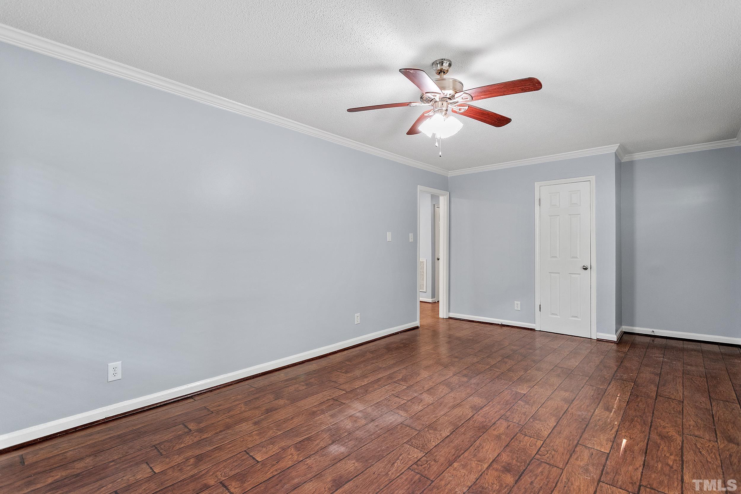 2921 Darrow Road Durham, NC 27704 - Photo 12 of 32 a view of an empty room with wooden floor