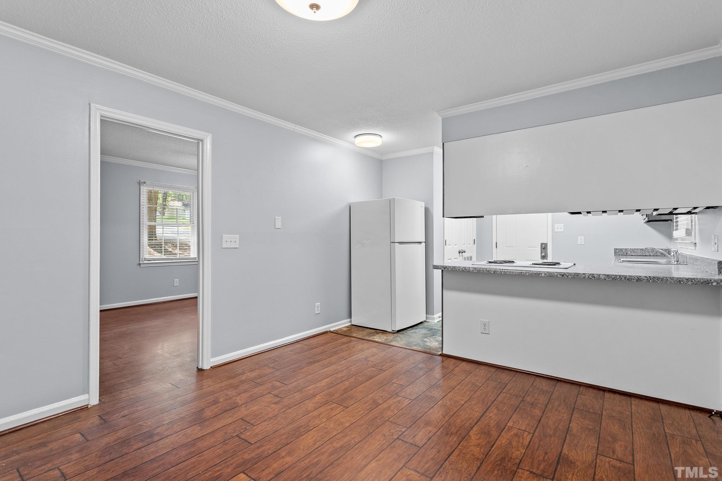 2921 Darrow Road Durham, NC 27704 - Photo 16 of 32 a view of kitchen with wooden floor
