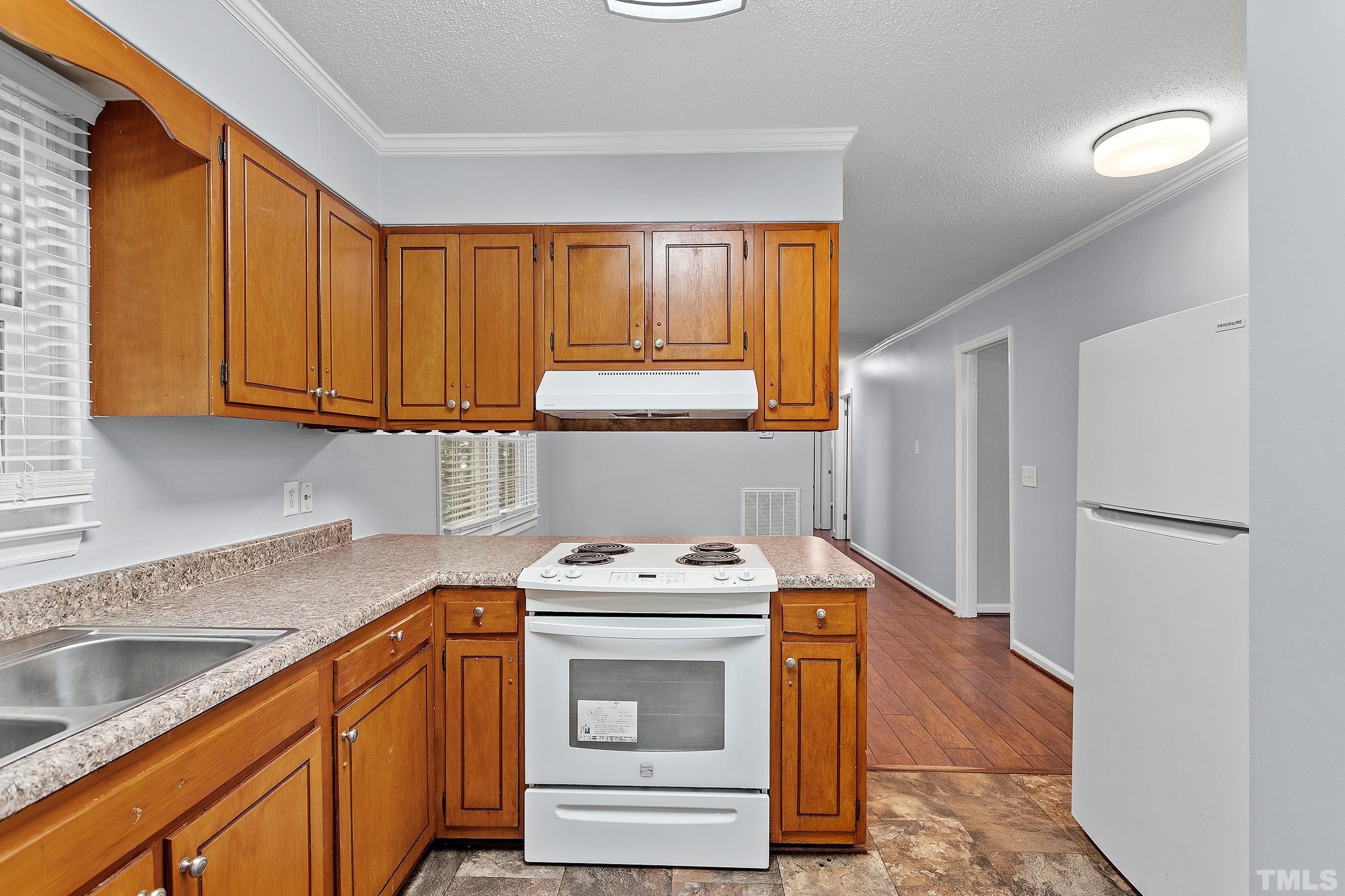 2921 Darrow Road Durham, NC 27704 - Photo 20 of 32 a utility room with washer and dryer