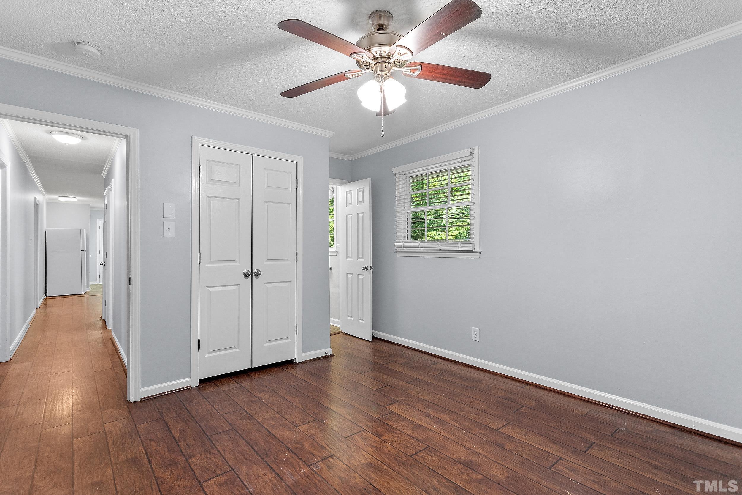 2921 Darrow Road Durham, NC 27704 - Photo 22 of 32 wooden floor in an empty room with a window