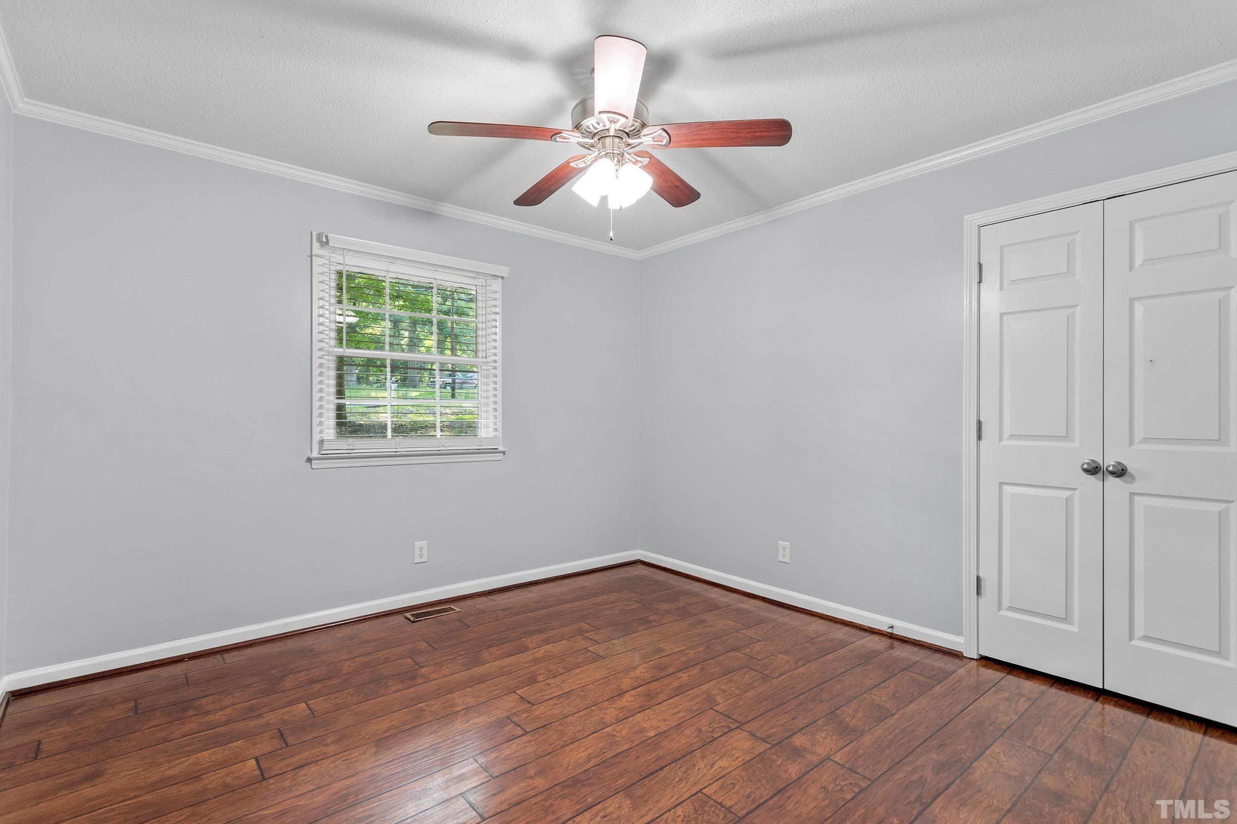 2921 Darrow Road Durham, NC 27704 - Photo 26 of 32 wooden floor in an empty room with a window