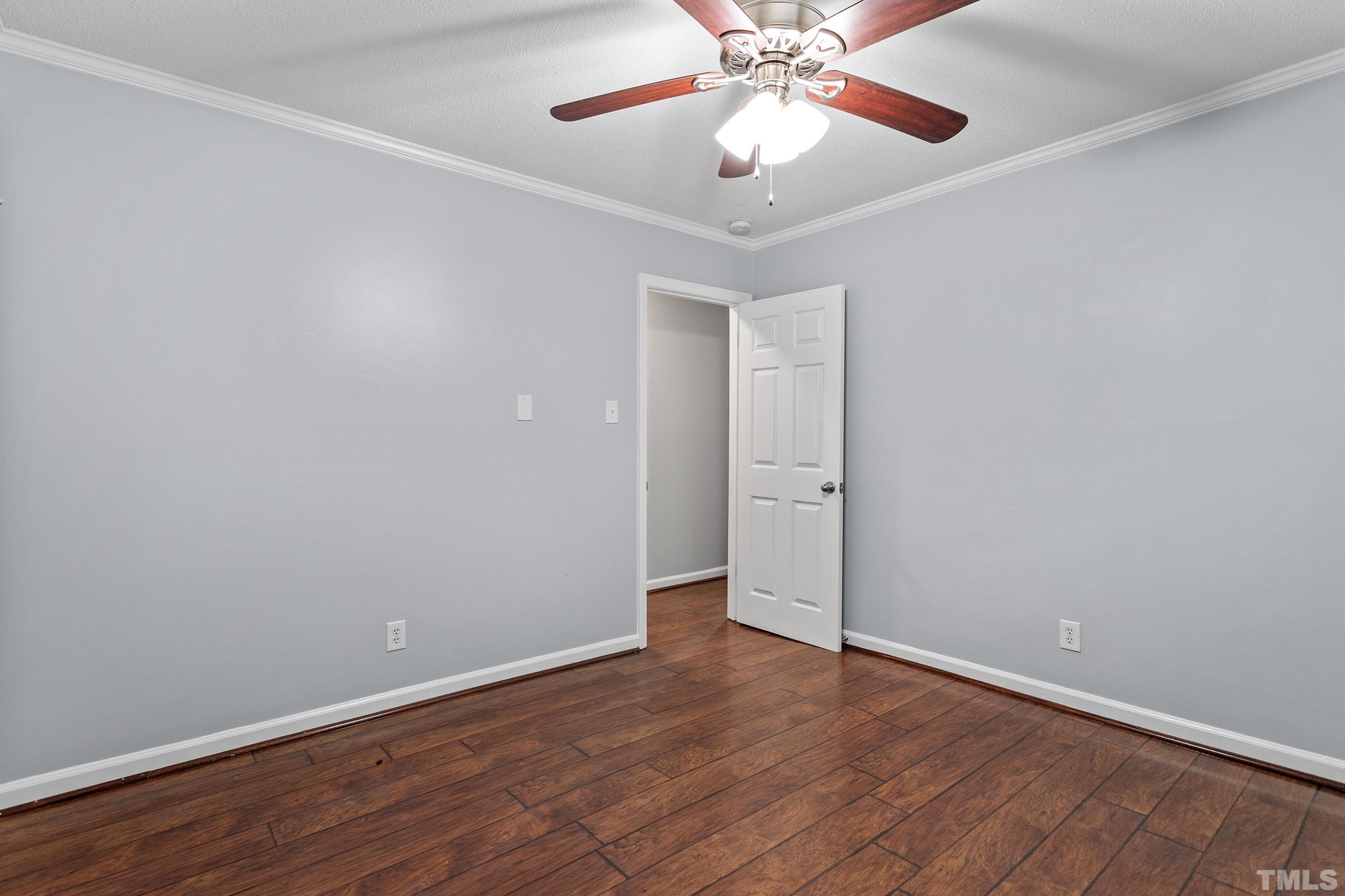 2921 Darrow Road Durham, NC 27704 - Photo 28 of 32 a view of an empty room with wooden floor