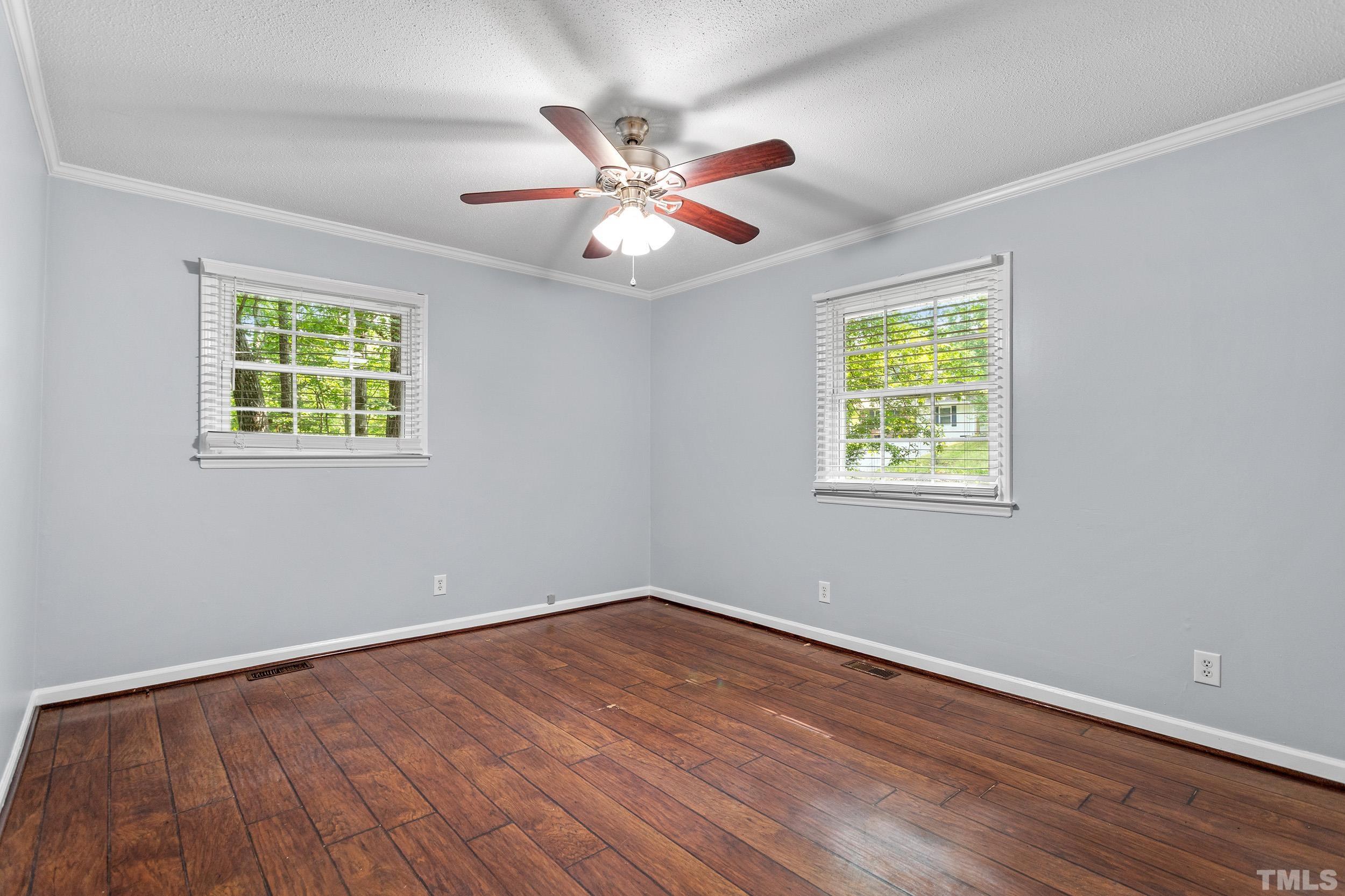 2921 Darrow Road Durham, NC 27704 - Photo 29 of 32 a view of an empty room with wooden floor and a window