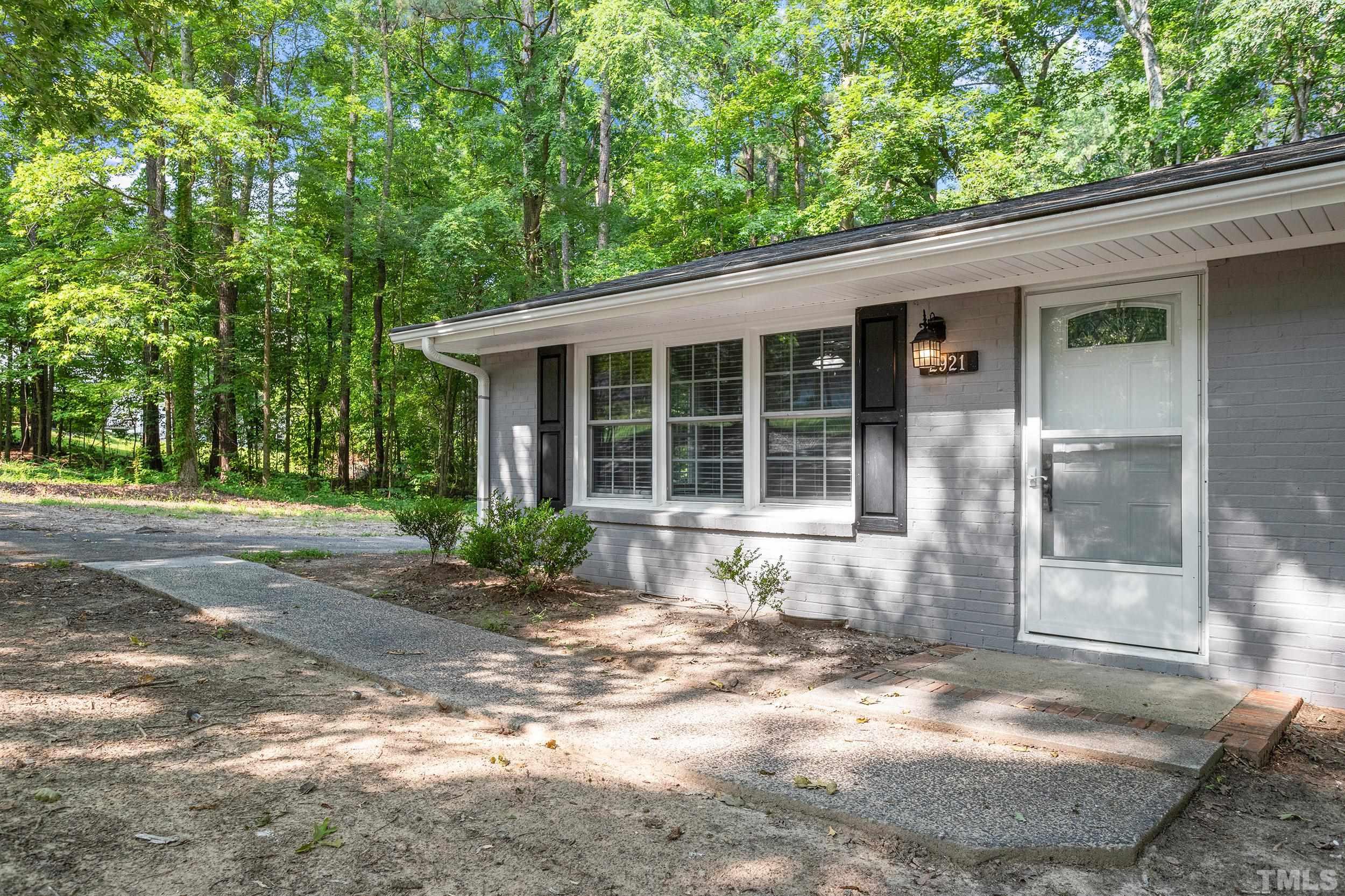 2921 Darrow Road Durham, NC 27704 - Photo 5 of 32 a front view of a house with a yard
