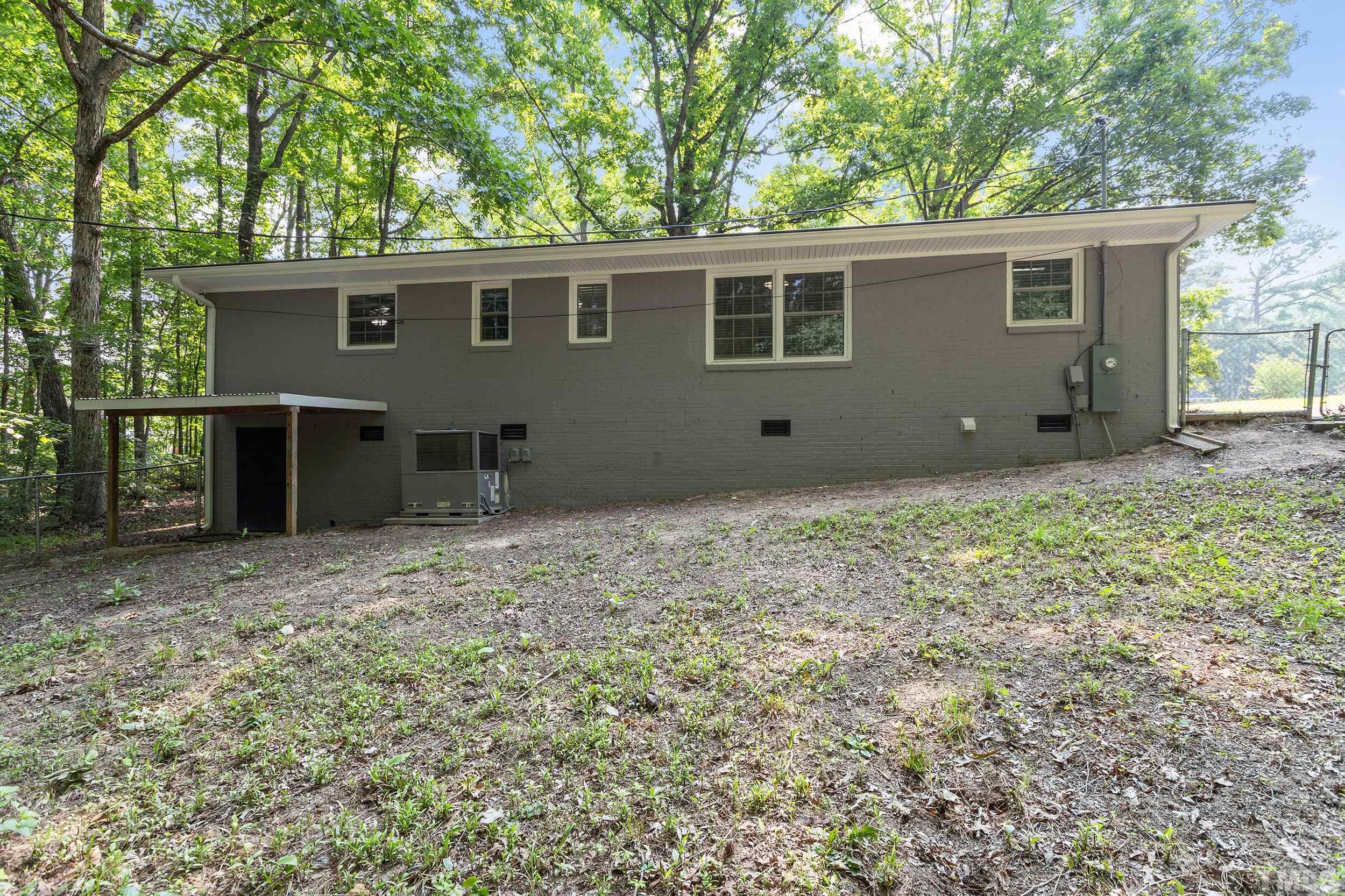 2921 Darrow Road Durham, NC 27704 - Photo 7 of 32 a house view with a backyard space