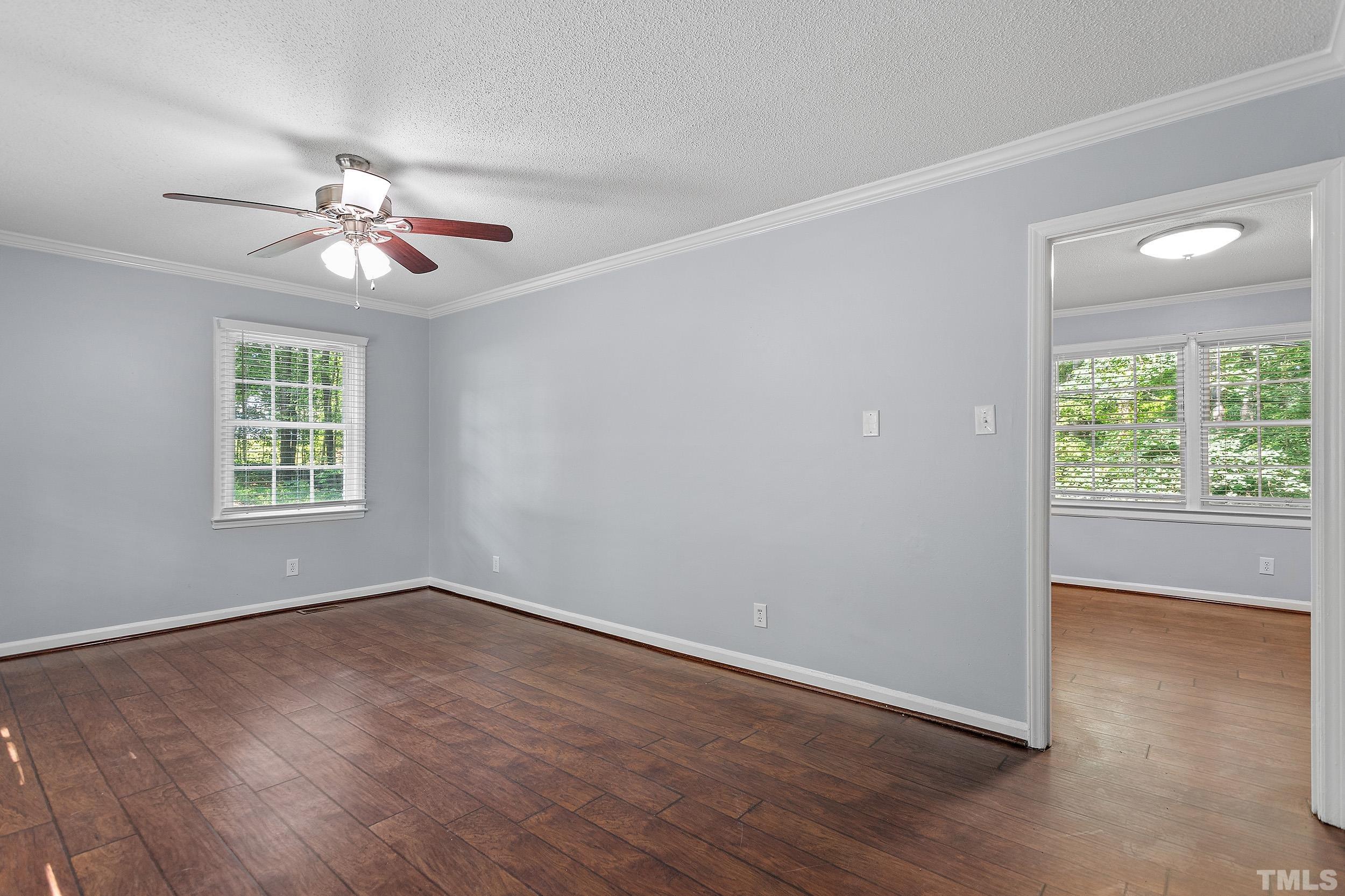 2921 Darrow Road Durham, NC 27704 - Photo 9 of 32 a view of wooden floor and windows in a room
