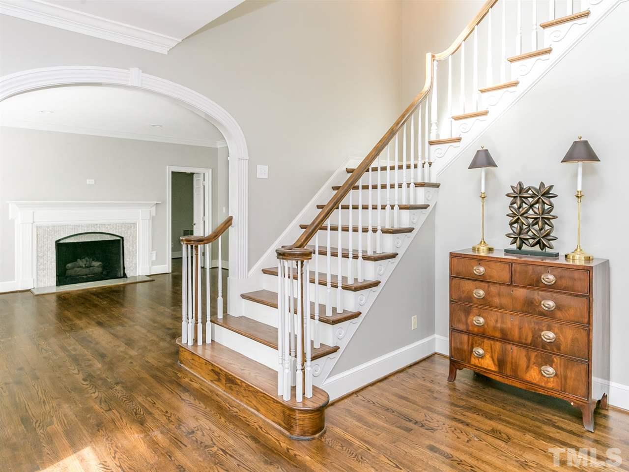 4038 John S Raboteau Wynd Raleigh, NC 27612 - Photo 2 of 25 a view of entryway with wooden floor and staircase