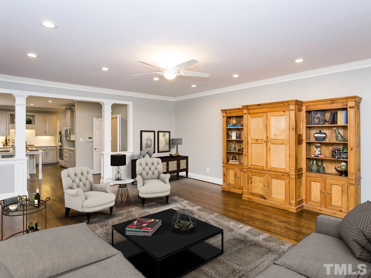 4038 John S Raboteau Wynd Raleigh, NC 27612 - Photo 11 of 25 a living room with furniture and wooden floor