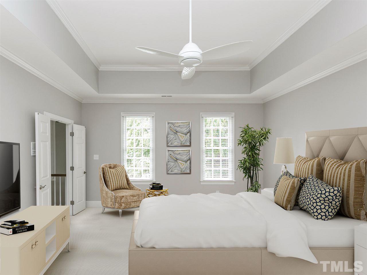 4038 John S Raboteau Wynd Raleigh, NC 27612 - Photo 13 of 25 a bedroom with a bed and a couch
