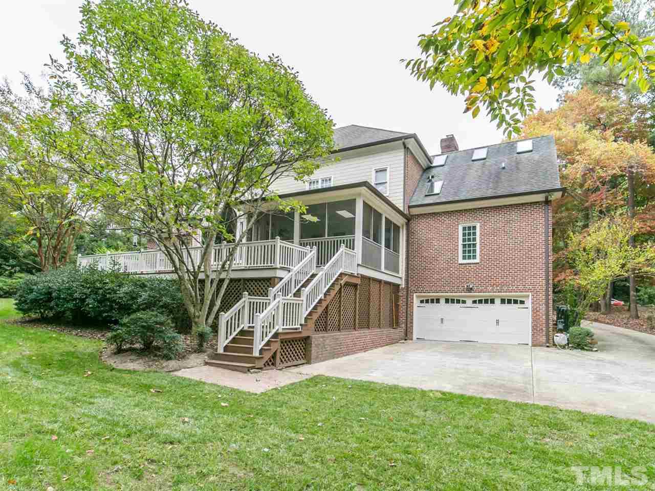 4038 John S Raboteau Wynd Raleigh, NC 27612 - Photo 25 of 25 a view of a house with a backyard and a slide