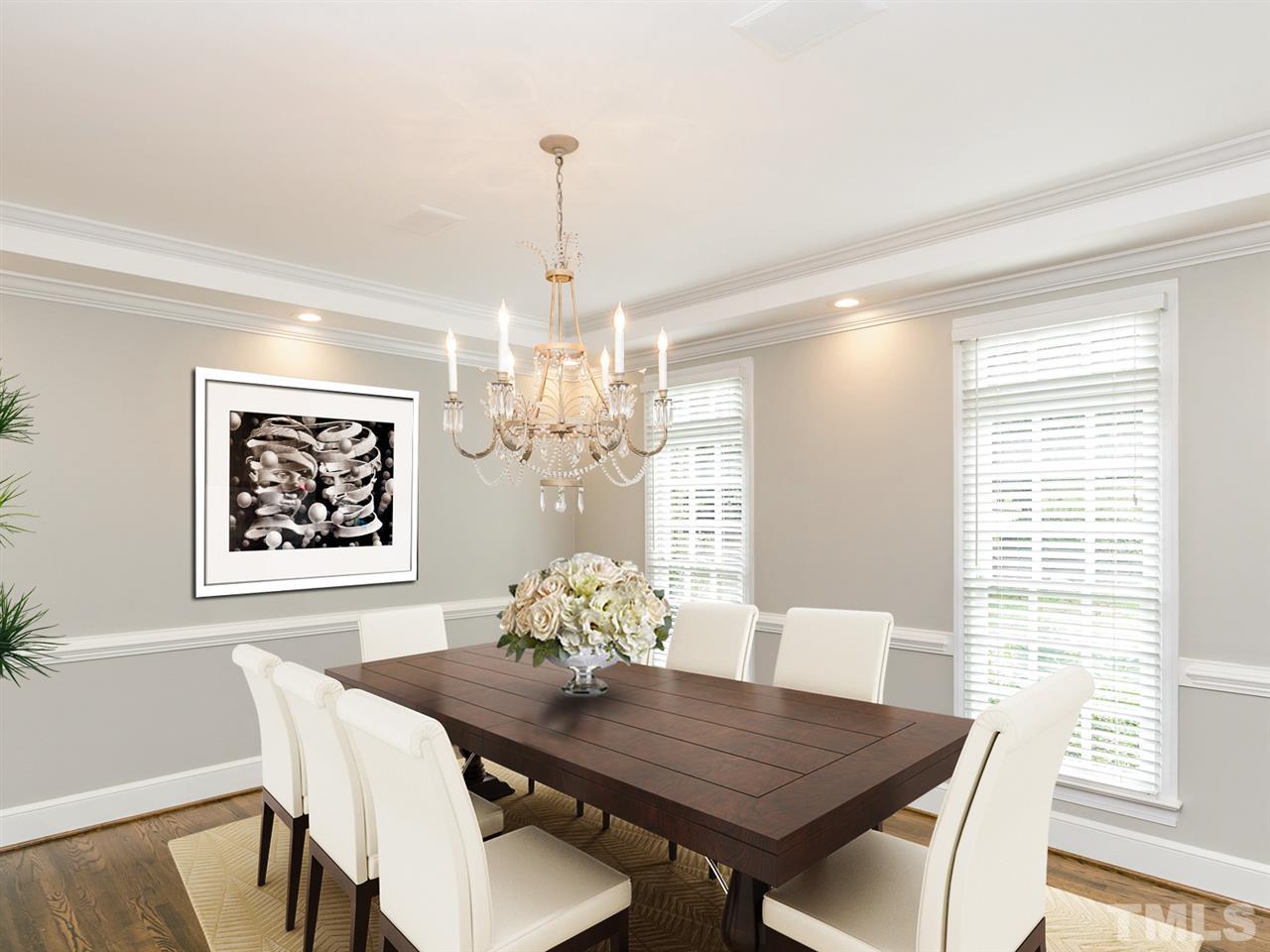 4038 John S Raboteau Wynd Raleigh, NC 27612 - Photo 4 of 25 a view of a dining room with furniture window and wooden floor