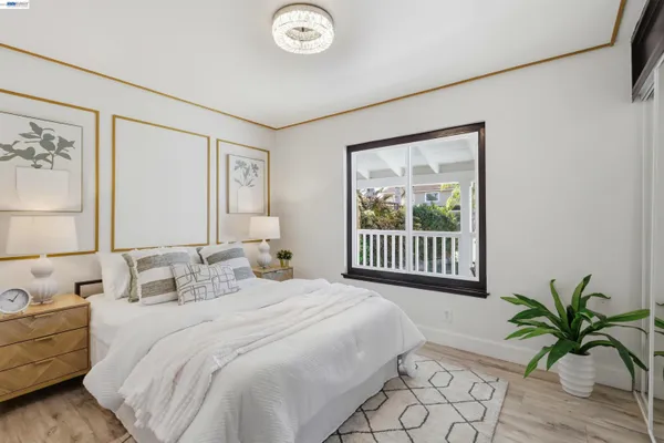 a bedroom with a bed and a mirror