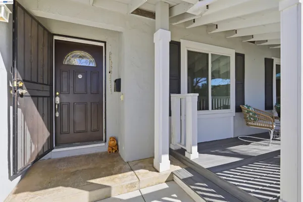 a bedroom with a bed and a mirror