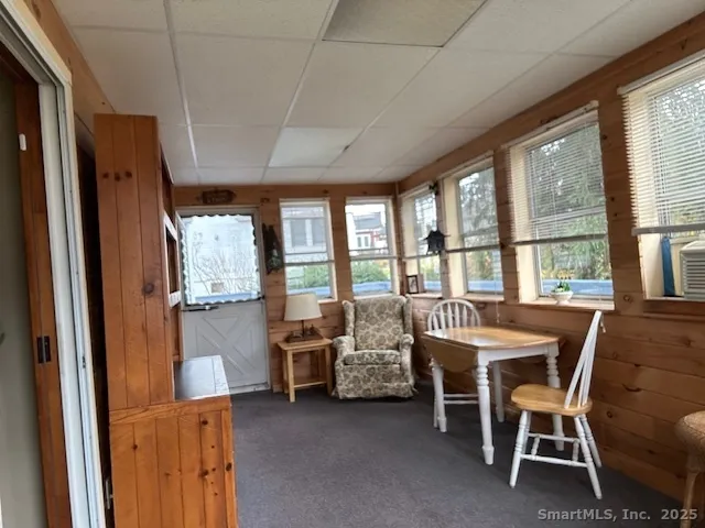 a view of a livingroom with furniture window and outside view