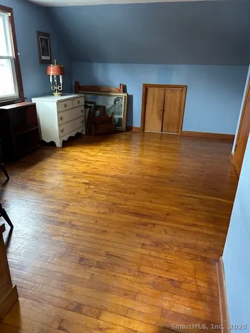 a kitchen with stainless steel appliances a sink counter top space cabinets and a window