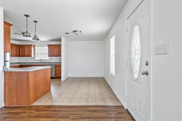 a view of a kitchen with a sink and cabinets