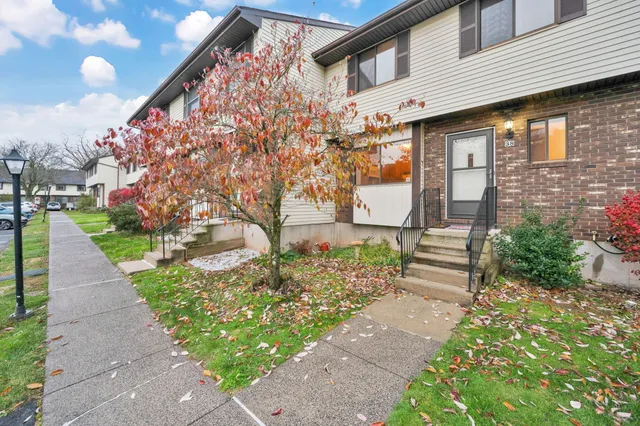 a front view of a house with garden