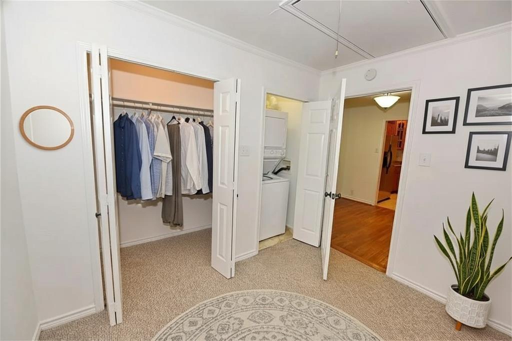 8502 Ridgelea Street Dallas, TX 75209 - Photo 14 of 37 a view of walk in closet with clothes and shoes