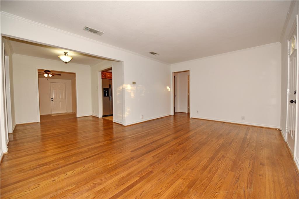 8502 Ridgelea Street Dallas, TX 75209 - Photo 23 of 37 a view of an empty room with wooden floor and closet
