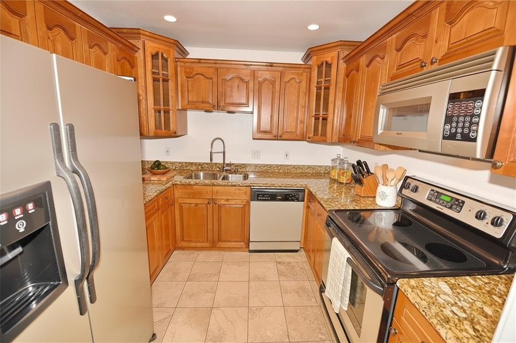 8502 Ridgelea Street Dallas, TX 75209 - Photo 37 of 37 a kitchen with stainless steel appliances a stove a sink and a refrigerator