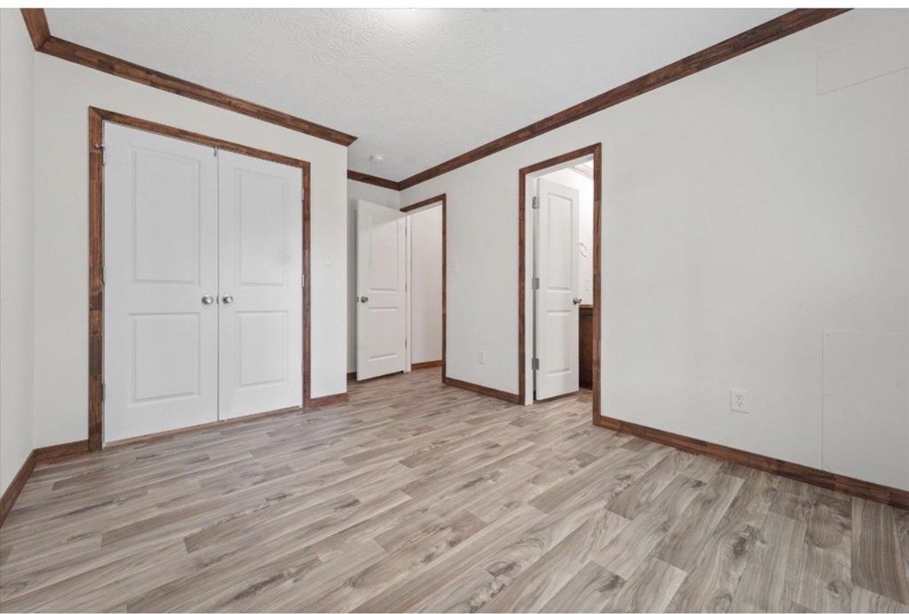 20774 Stevens New Caney, TX 77357 - Photo 6 of 7 a view of an empty room with wooden floor and closet