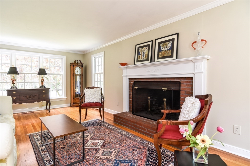 114 Hunters Ridge Road Concord, MA 01742 - Photo 5 of 38 a living room with furniture and a fireplace
