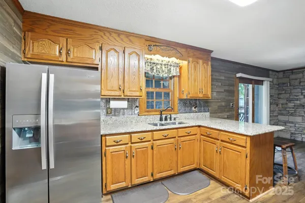 a kitchen with a sink cabinets and window